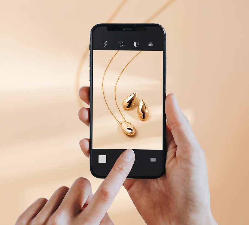gold earrings and necklace open in smartphone browser